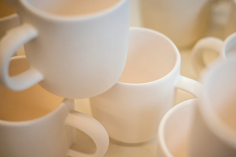 white coffee cups on top of each other