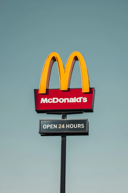 a large mcdonald's open 24 hours sign