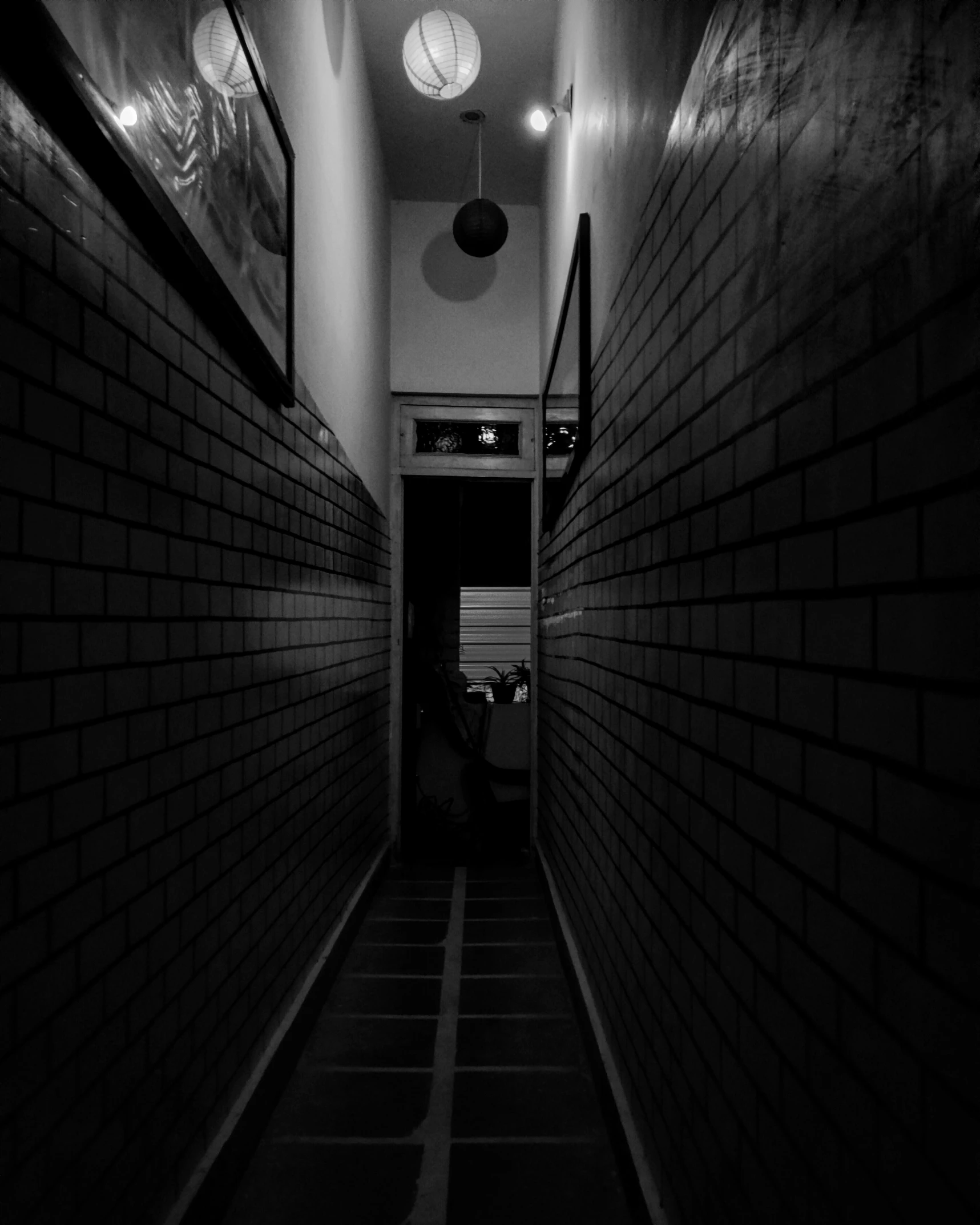 black and white po of a hallway in a building