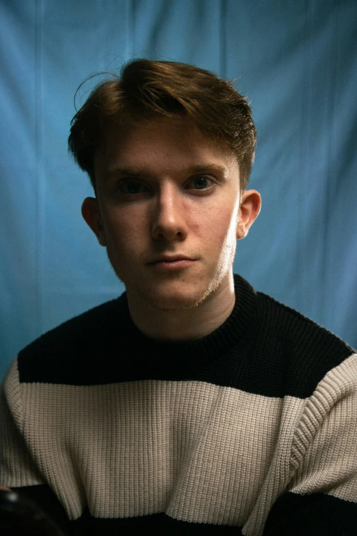 a young man that is holding a racquet in his hand