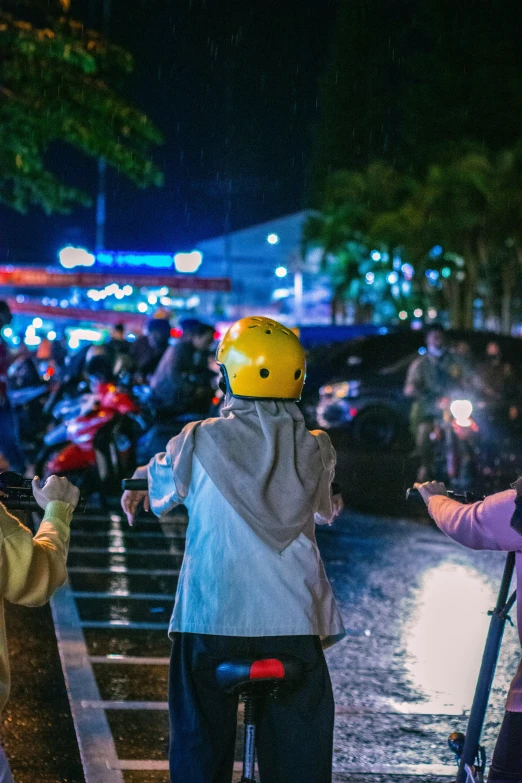 people looking at the lights while a bike is being ridden