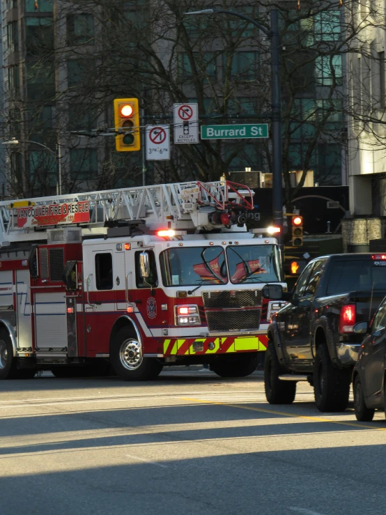 a fire truck pulling out another car across the street