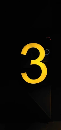 neon yellow number on black background sign with numbers