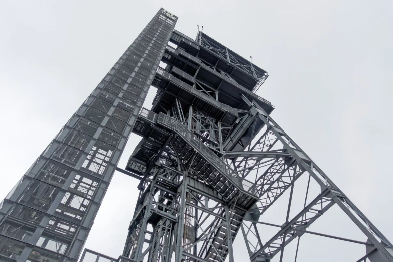 a tall structure with metal pipes coming out of the top