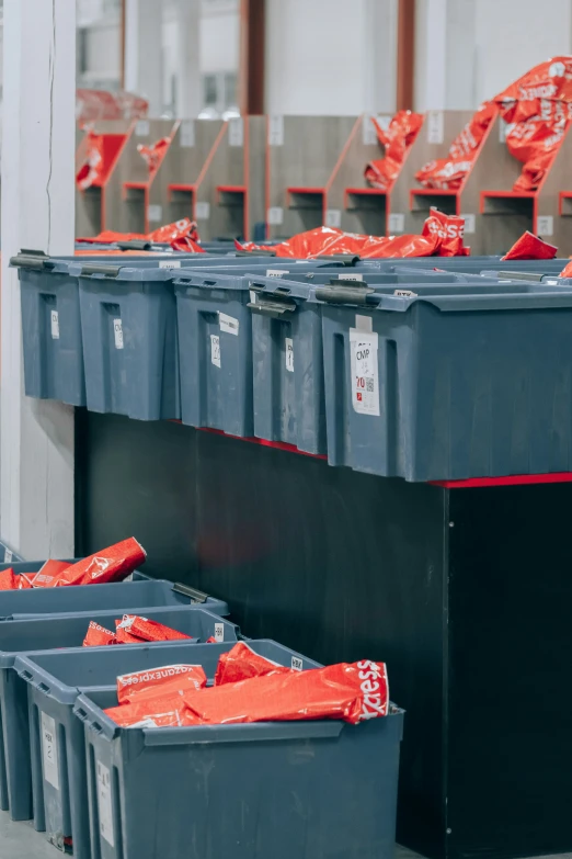 there is lots of bags on the top of a bin