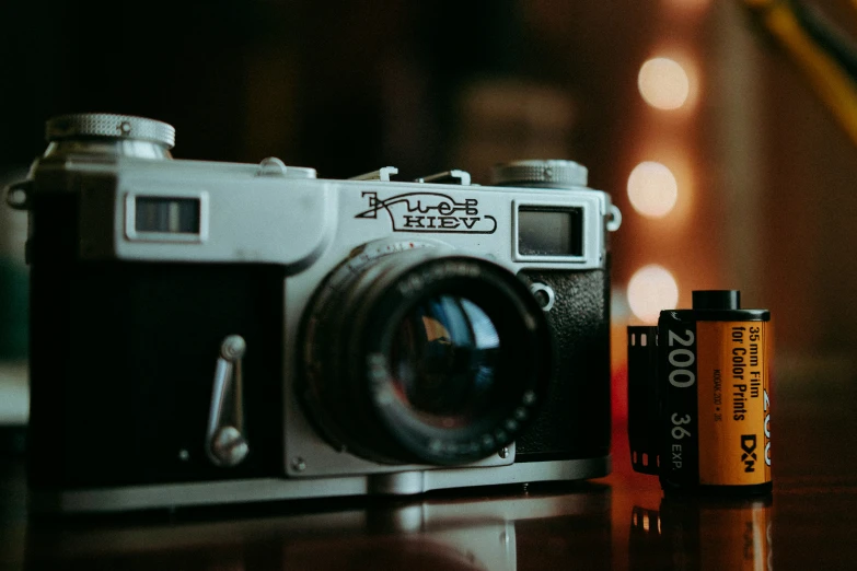 an old fashioned camera sitting on top of a table