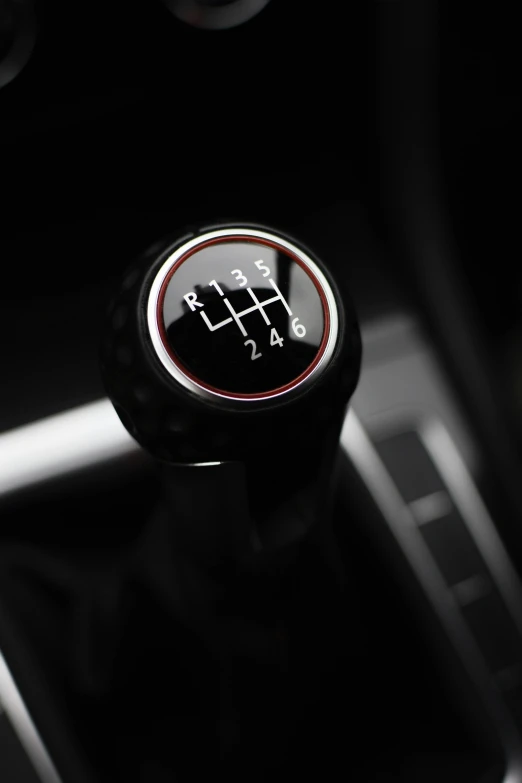 a black and white picture of a gear stick