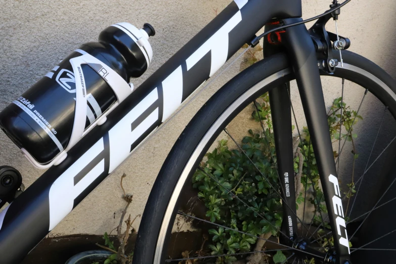 a bike with water bottles attached to the handle bars