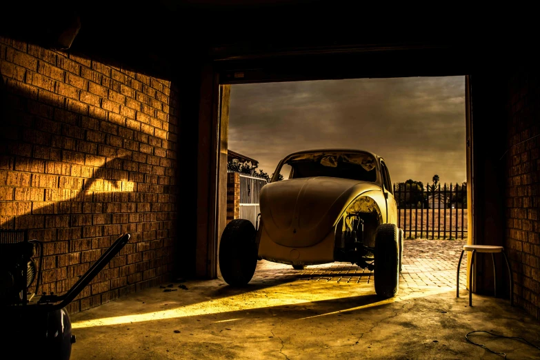 an old fashion car in a garage is illuminated by the sun shining
