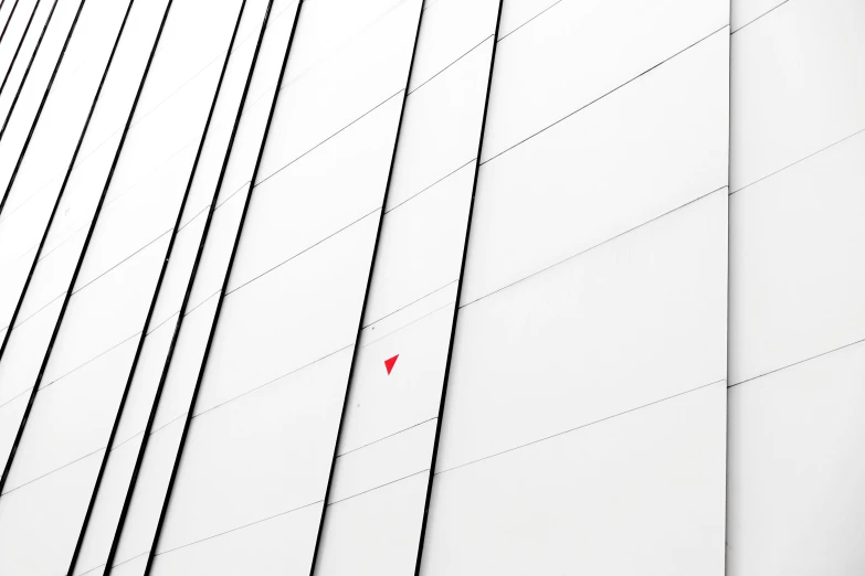 the corner of a building with lines and lines painted on it