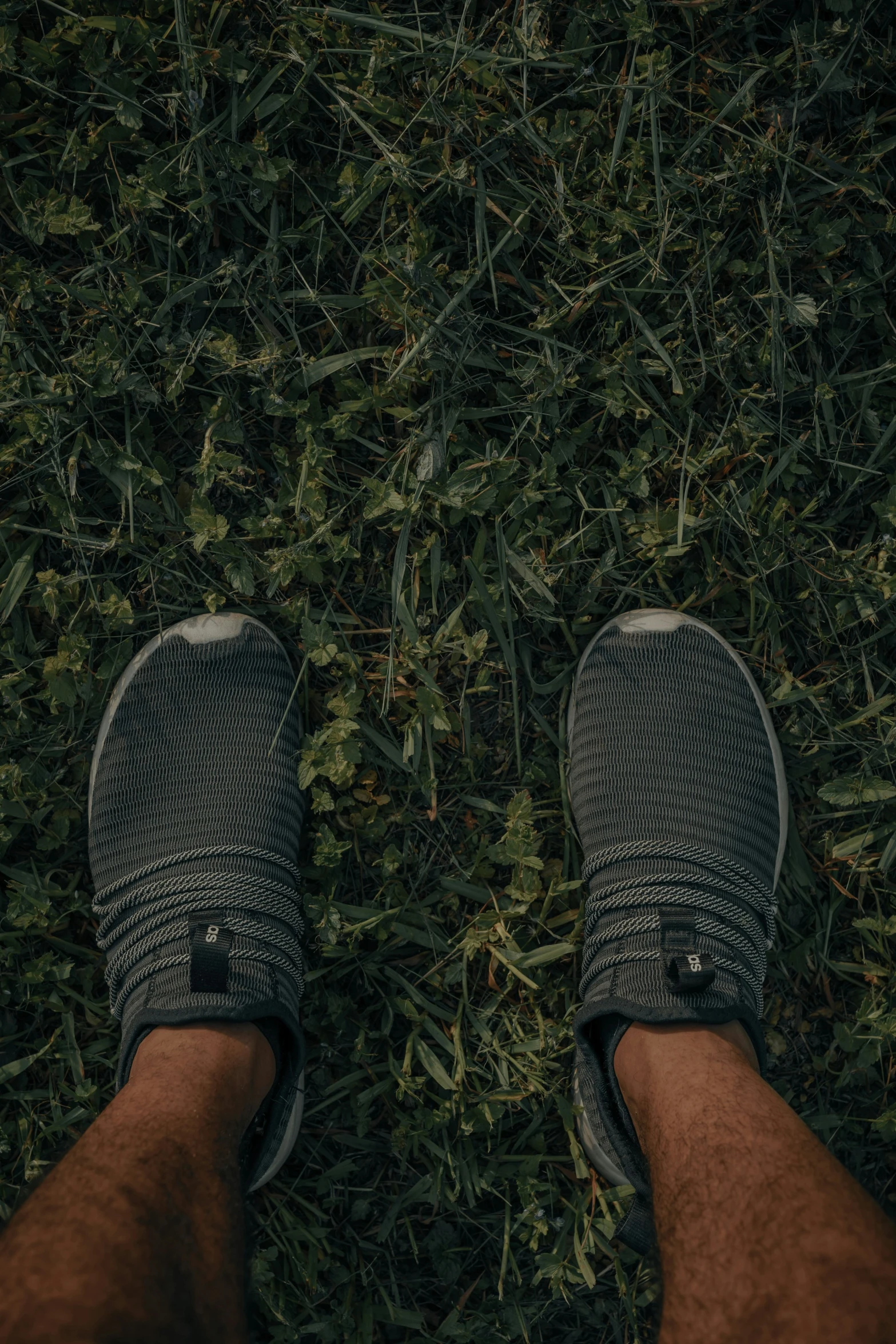 a person standing on top of a grass covered field