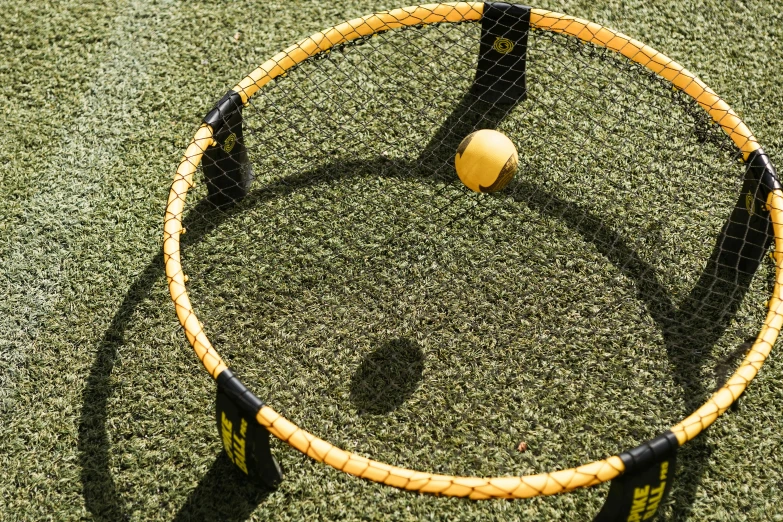 the racket is placed with a tennis ball