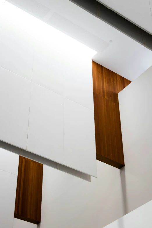 the interior of a building with white walls and wood trimmings