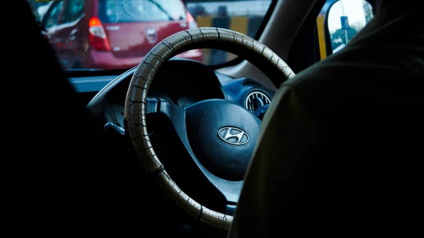 the steering wheel of a vehicle in a parking lot