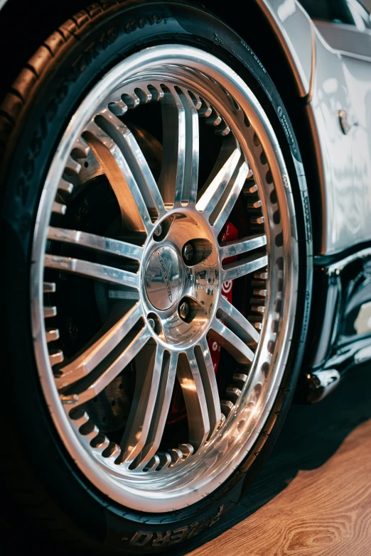 a chrome colored tire of a sport car