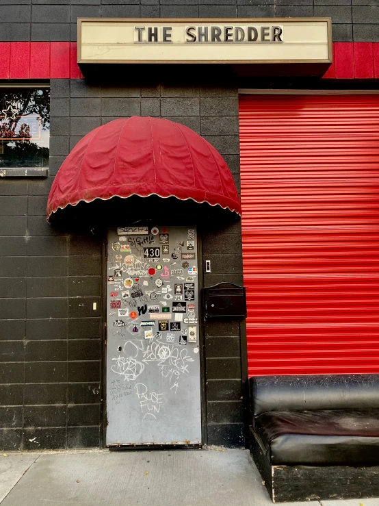 there is a red umbrella outside the door