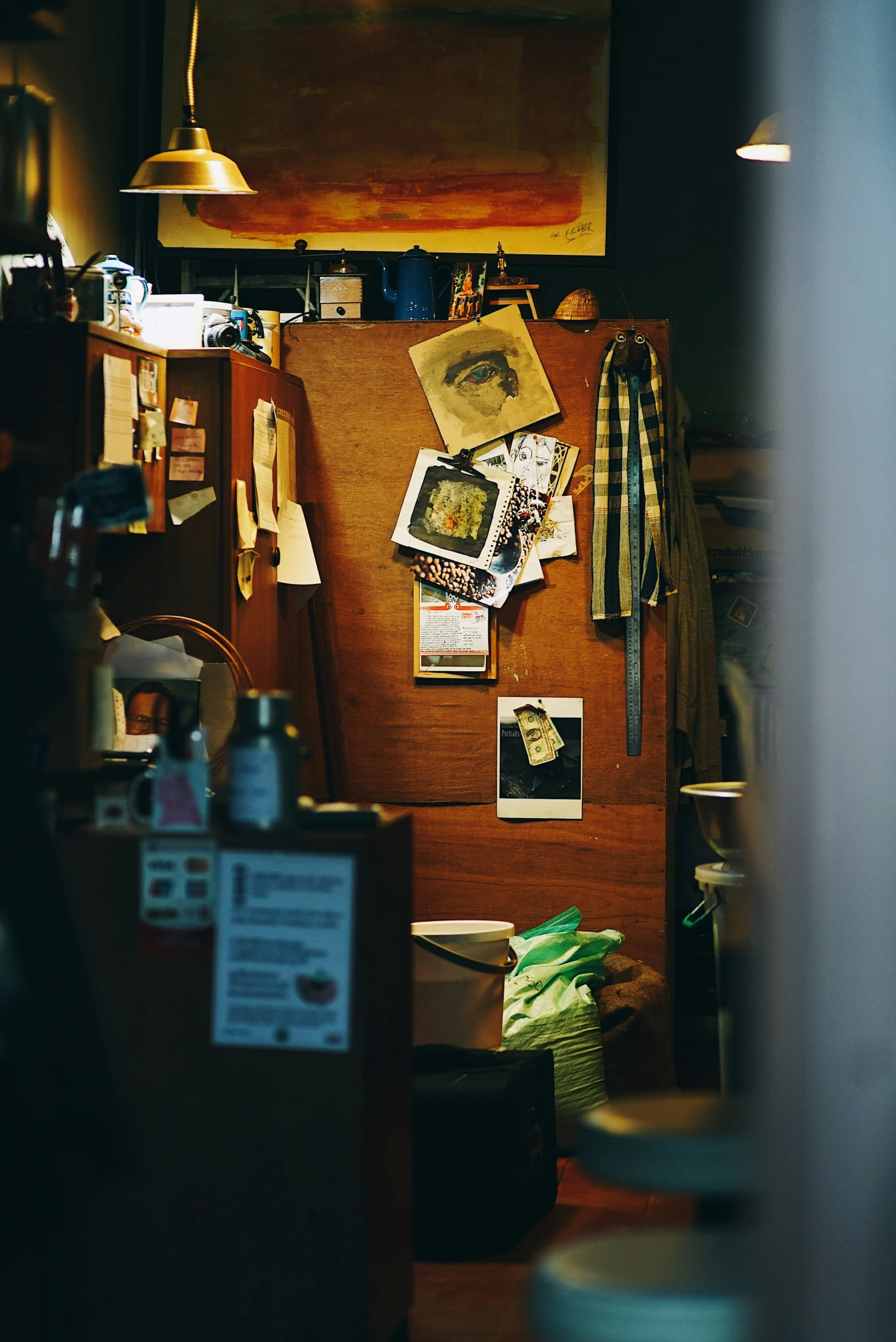 the fridge is covered with paper and pictures