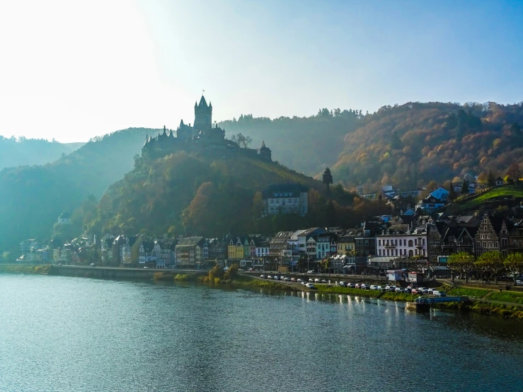 an image of a town on the hill overlooking a lake