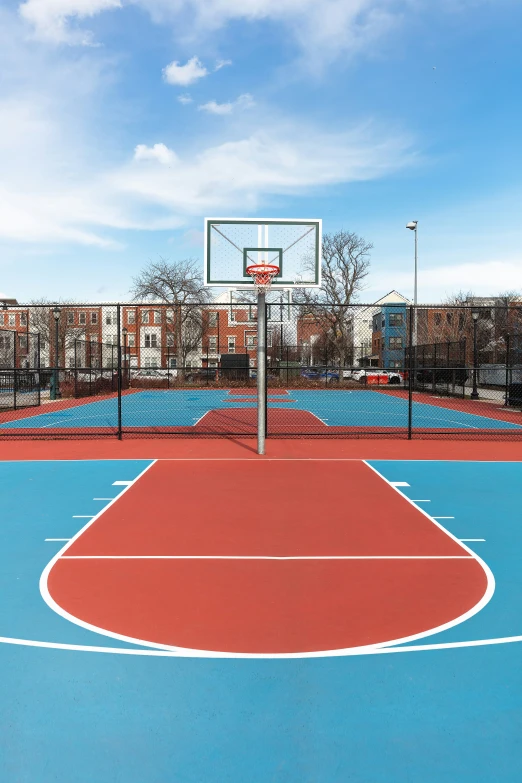 a basketball court with a blue and red color scheme
