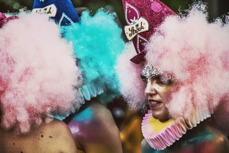 the two ladies are dressed up and having colored hair