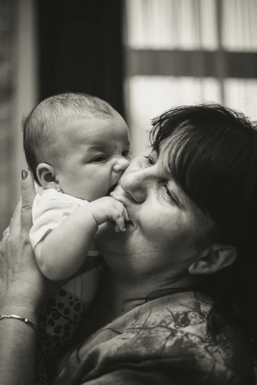 an image of a woman holding a baby