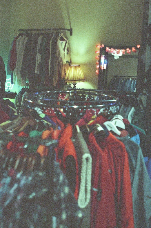 a room filled with various types of shirts
