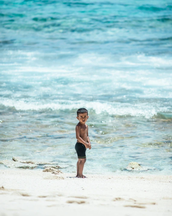 a  walking on the sand near the ocean