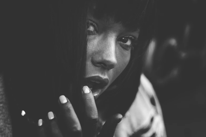 a close up of a person smoking a cigarette