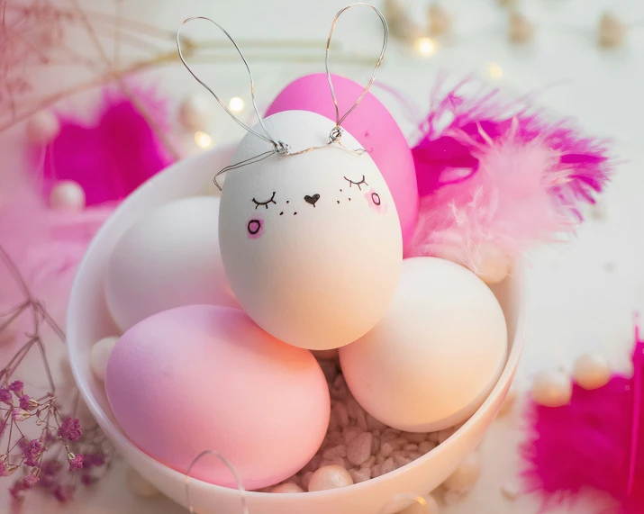 three eggs are stacked up on a table