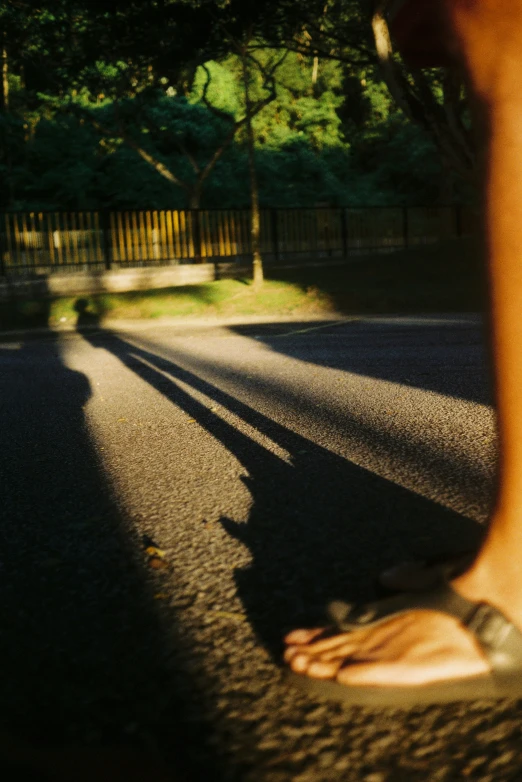 closeup of a person's foot as they cross the road