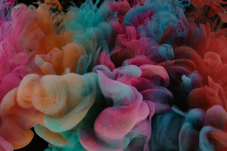 colored powders being mixed in water, on display