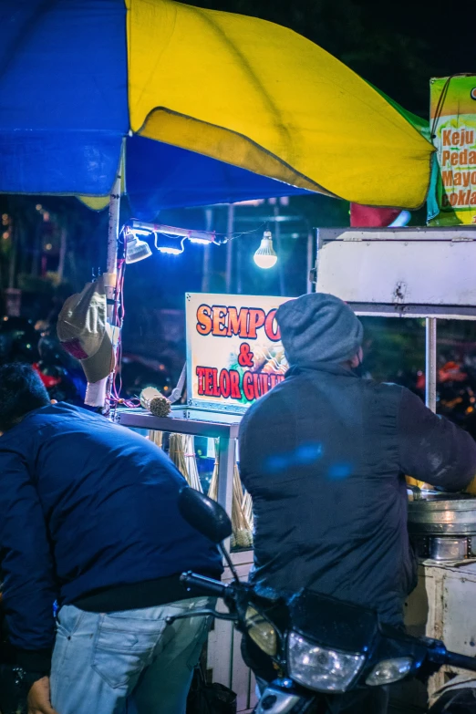 a bike sits at the end of a food stand