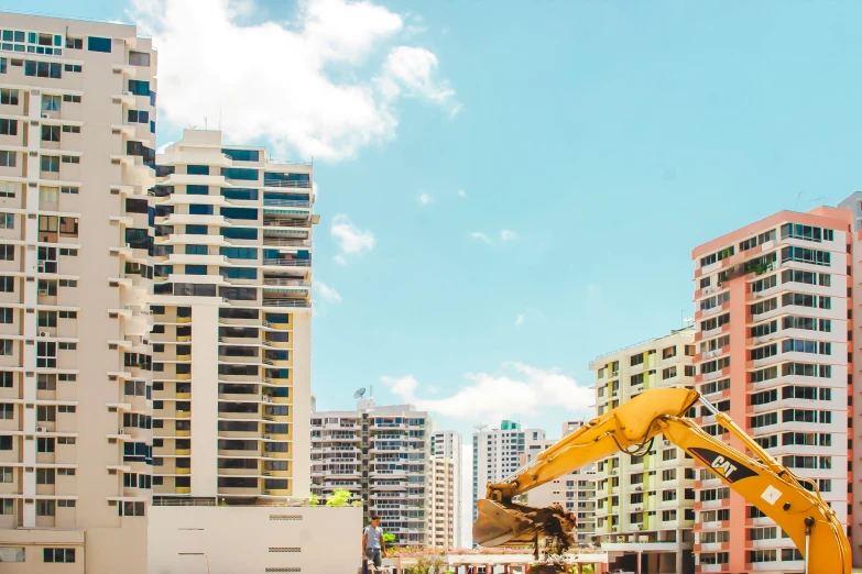 construction work is underway in the foreground while skyscrs are in the background