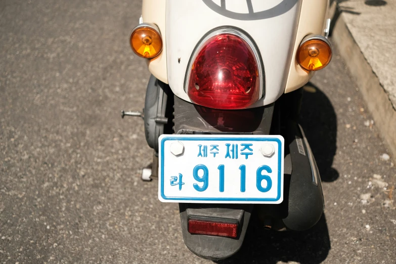 a scooter has an chinese license plate on it