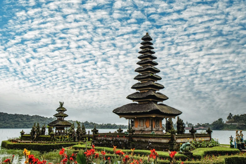 a tall tower with a bunch of people near by