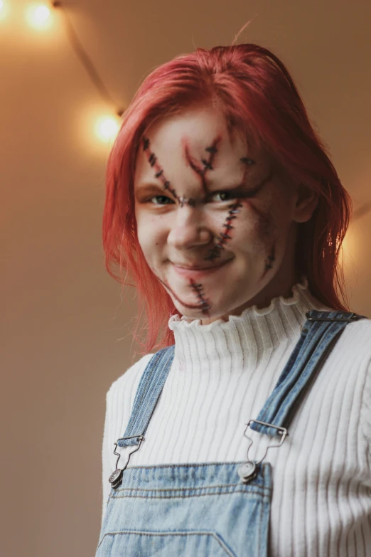 a woman with red hair and makeup looks into the camera