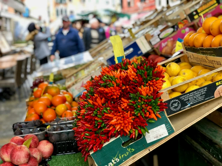 fruit at the farmers market with people shopping