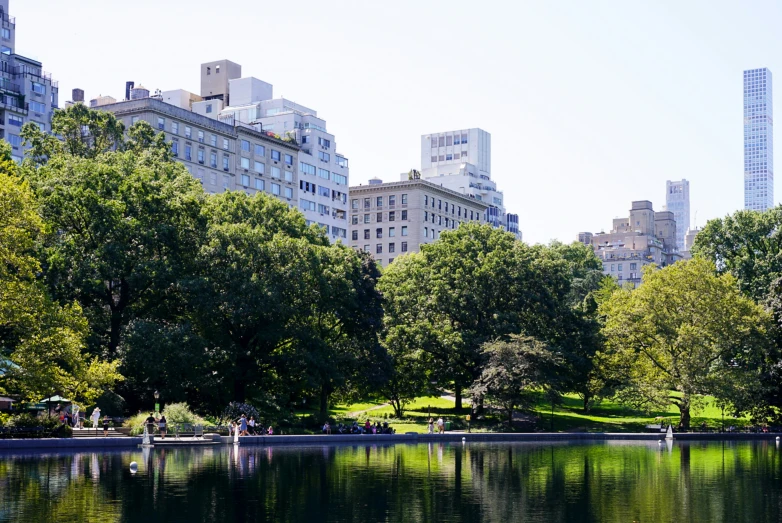 a river near many tall buildings in the city