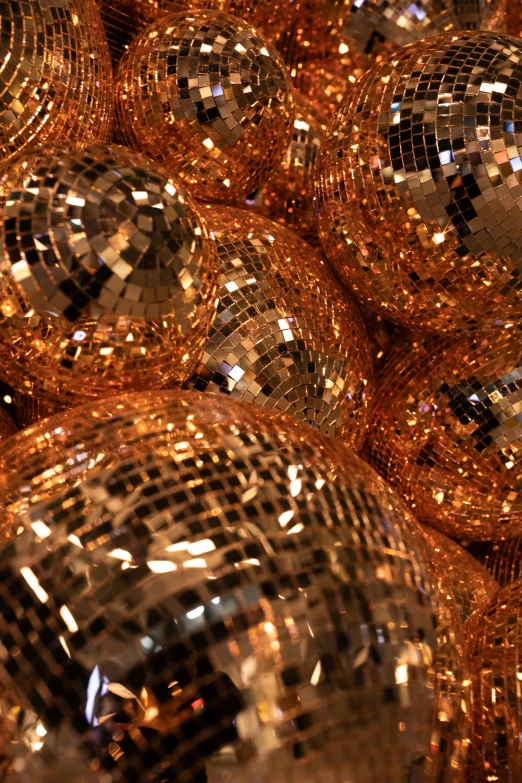 shiny disco balls on display in the sunlight