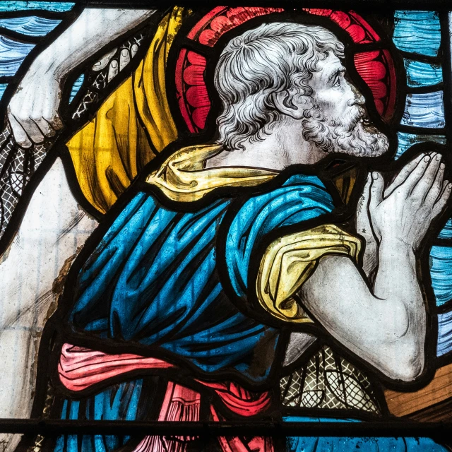 a stained glass in a church depicting jesus