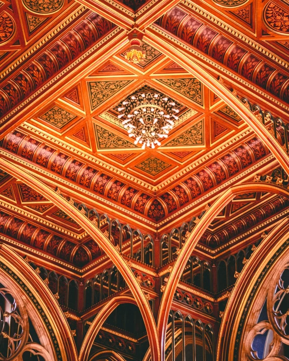 the inside of an old building with intricate ceilings and painted wood