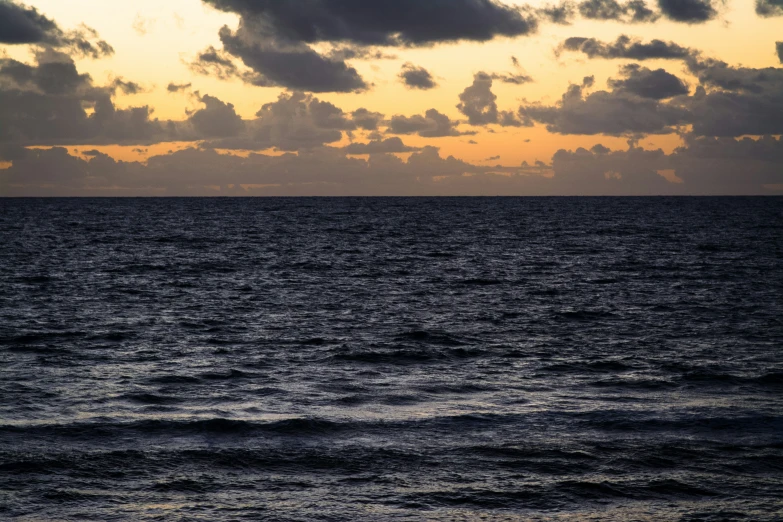 a large body of water on a cloudy day