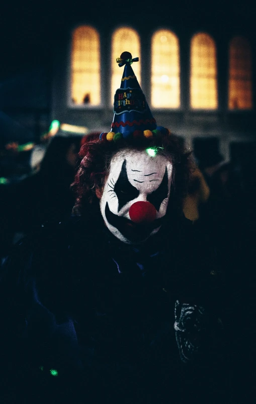 a person with a clown hat and a clown face