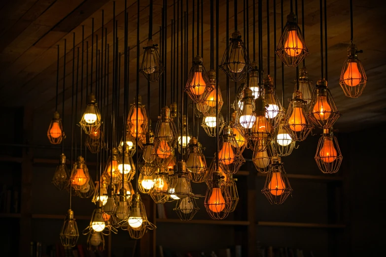 a large number of chandeliers hanging from a ceiling