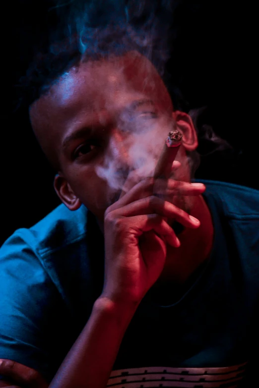 an image of man smoking on a black background