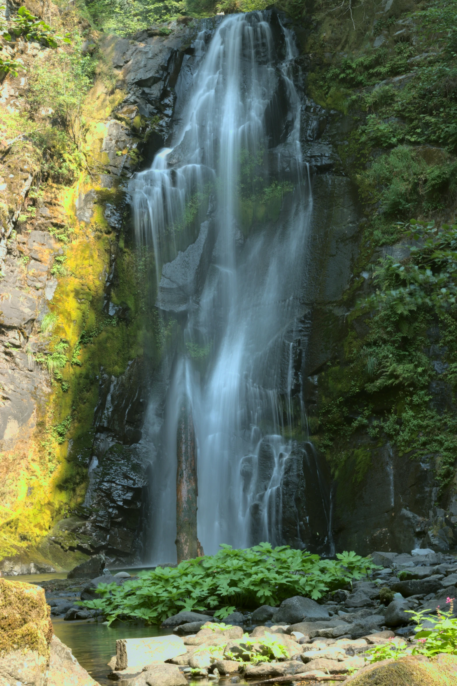 there is a large waterfall at the top of this mountain