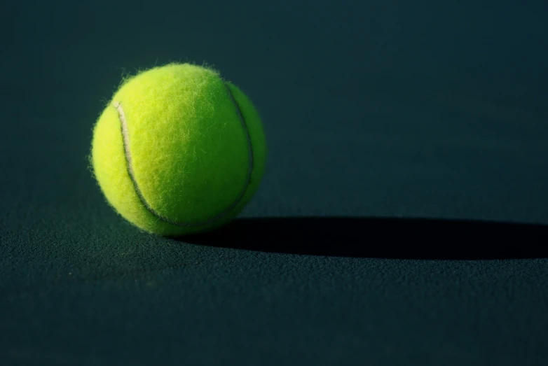 a tennis ball on a court that is empty