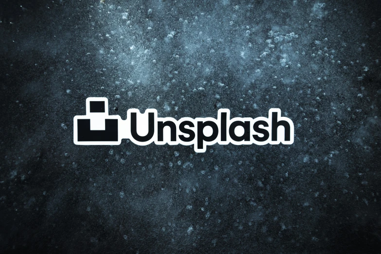 the word unplash is written over a dark background