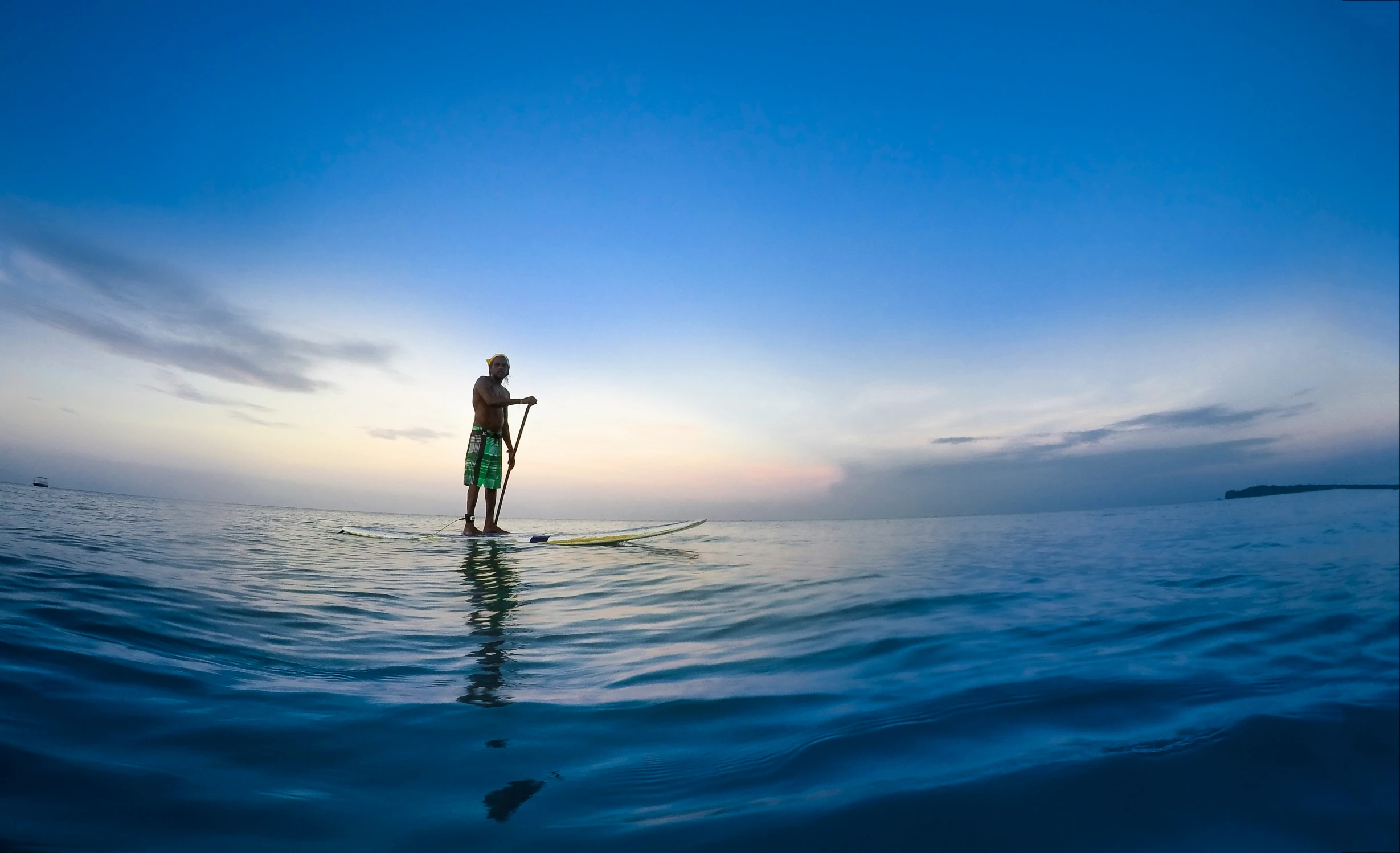 a person riding a surfboard in the ocean