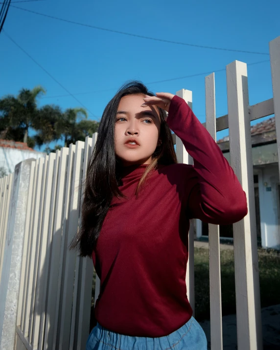 a woman standing outside posing for the camera